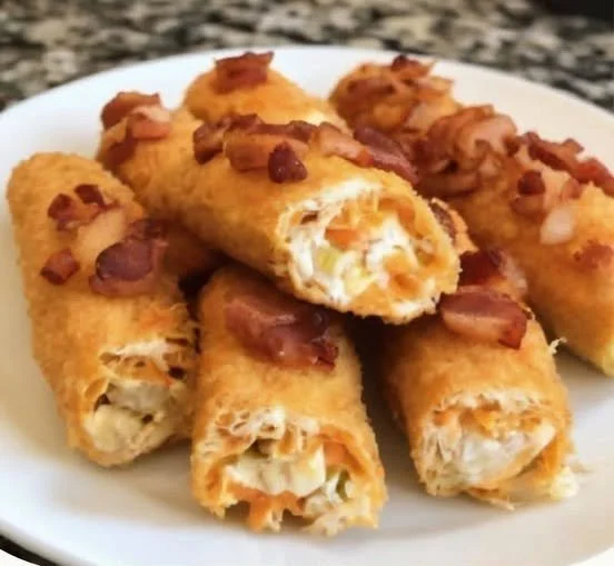 Buffalo Chicken Bacon Cheese Stick Bombs Buffalo Chicken Cheese Stick Bombs with bacon and cheese on a plate