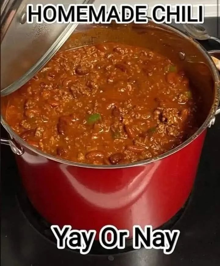 Delicious bowl of chili topped with sour cream and cilantro