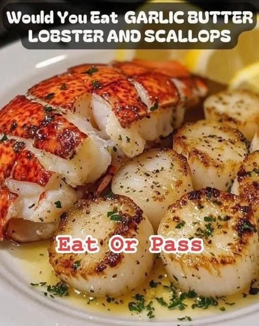 Garlic Butter Lobster and Scallops Delicious garlic butter lobster and scallops served elegantly on a plate.