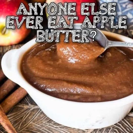 Homemade Apple Butter Homemade apple butter in a jar with fresh apples and cinnamon sticks