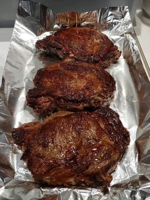 Ribeye Steaks Delicious ribeye steaks grilled to perfection on a barbecue