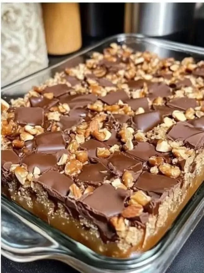 Delicious homemade Caramel Chocolate Crunch Bars stacked together.