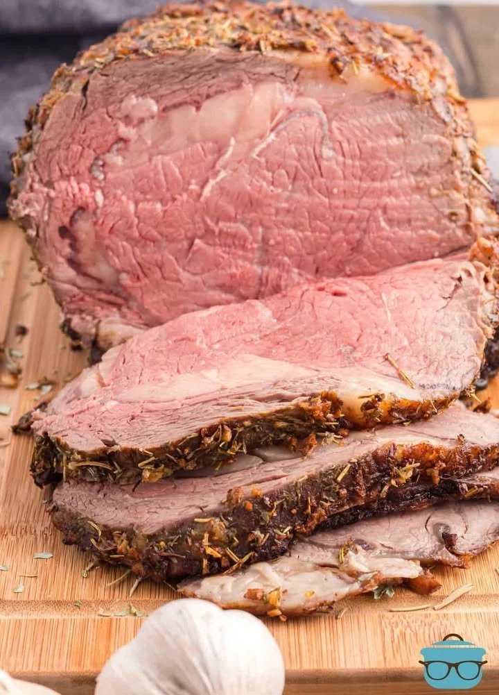 Garlic Butter Prime Rib A succulent garlic butter prime rib roast served with herbs and sides.