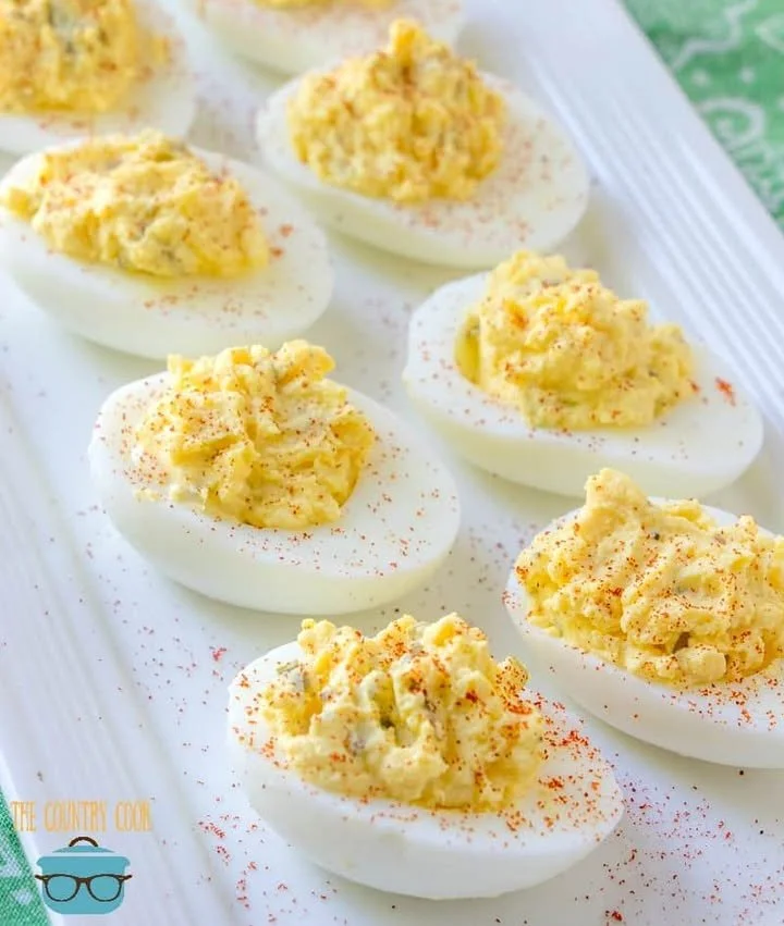 The Best Ever Deviled Eggs Plate of the best ever deviled eggs garnished with paprika and herbs